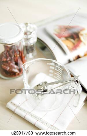 Stock Image - Measuring cup in kitchen. Fotosearch
