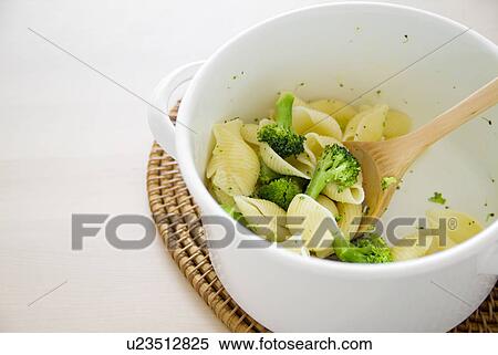 Stock Photography - Pasta and broccoli in pot. Fotosearch