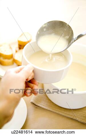 Serving soup into cup View Large Photo Image Picture - Serving soup into cup. Fotosearch