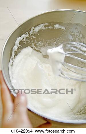 Picture - Whisking egg white. Fotosearch