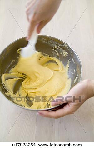 A woman mixing flour and egg, blurred motion View Large Photo Image Picture - A woman mixing flour and egg, blurred motion. Fotosearch