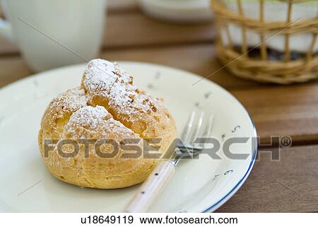 Cream puff on plate View Large Photo Image Stock Photo - Cream puff on plate. Fotosearch