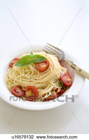 Stock Image - Spaghetti with tomatoes and basil. Fotosearch