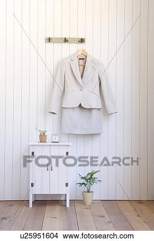 Picture - Suit hung on wall. Fotosearch