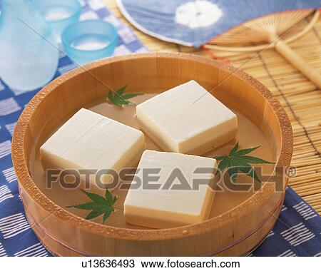 Stock Image - Bean Curd in a bamboo tub. Fotosearch