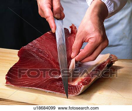 Stock Photo - Chef cutting tuna. Fotosearch