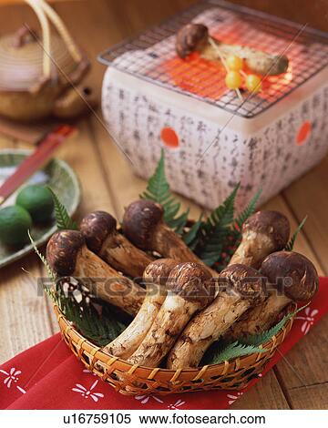 Stock Photography - Matsutake Mushrooms and a charcoal grill. Fotosearch