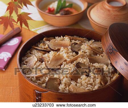 Stock Image - Steamed rice with matsutake mushrooms. Fotosearch