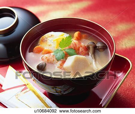 Stock Image - Cooked rice cake in soup. Fotosearch