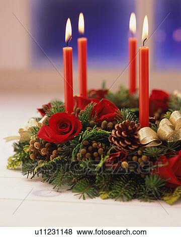Candles with wreath, close-up View Large Photo Image Stock Photo - Candles with wreath, close-up. Fotosearch
