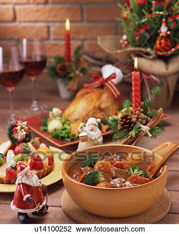 Stock Image - Plenty dishes arranged for Christmas dinner. Fotosearch