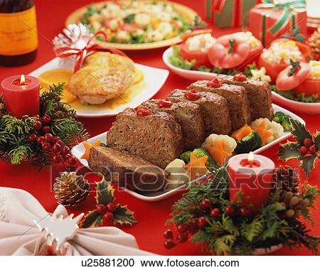 Stock Image - Plenty dishes arranged for Christmas dinner. Fotosearch