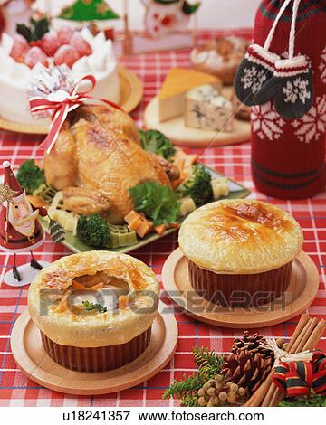 Stock Photo - Plenty dishes arranged for Christmas dinner. Fotosearch