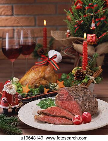 Stock Photo - Roast Beef and Roast Chicken for Christmas dinner. Fotosearch