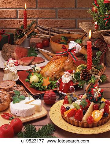 Roast chicken along with dessert on Christmas eve View Large Photo Image Stock Photo - Roast chicken along with dessert on Christmas eve. Fotosearch