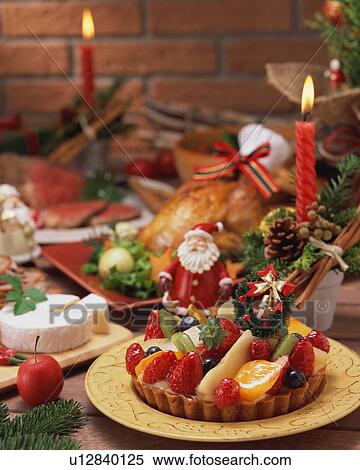 Stock Photography - Roast chicken and strawberry cake for Christmas dinner. Fotosearch