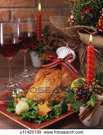 Roast chicken and two wineglasses served on table View Large Photo Image Stock Photo - Roast chicken and two wineglasses served on table. Fotosearch
