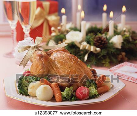 Stock Photo - Roast chicken on plate. Fotosearch