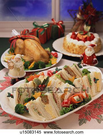 Stock Photography - Sandwiches and roast chicken served for Christmas dinner. Fotosearch