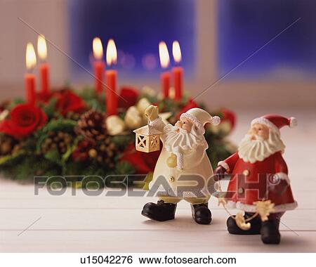 Statuettes of two Santa Claus on table View Large Photo Image Stock Photograph - Statuettes of two Santa Claus on table. Fotosearch