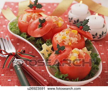 Stock Image - Tomatoes stuffed with pilaf on tray. Fotosearch