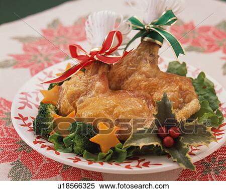 Stock Photography - Two roasted chicken legs on plate. Fotosearch