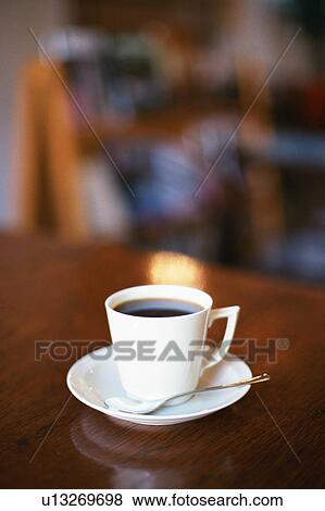 Coffee cup on table View Large Photo Image Stock Photo - Coffee cup on table. Fotosearch