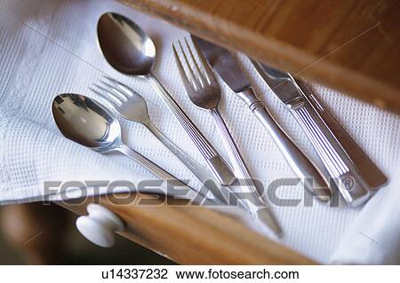Stock Image - Cutlery on drawer. Fotosearch