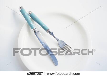 Cutlery on plate View Large Photo Image Stock Image - Cutlery on plate. Fotosearch