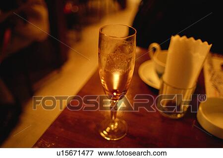 Glass on a table View Large Photo Image Stock Photo - Glass on a table. Fotosearch