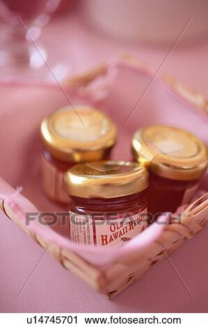 Jars of jam in a basket View Large Photo Image Stock Image - Jars of jam in a basket. Fotosearch