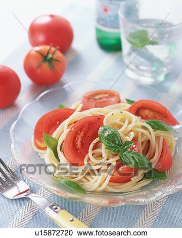 Stock Image - Cold spaghetti with tomatoes. Fotosearch