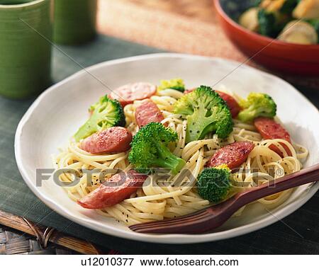 Spaghetti with sausage and broccoli View Large Photo Image Stock Photo - Spaghetti with sausage and broccoli. Fotosearch