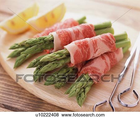 Asparagus wrapped with pork View Large Photo Image Stock Photo - Asparagus wrapped with pork. Fotosearch