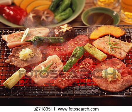 Assorted meat grilled over charcoal View Large Photo Image Stock Image - Assorted meat grilled over charcoal. Fotosearch