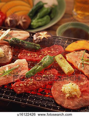 Assorted meat grilled over charcoal View Large Photo Image Stock Photograph - Assorted meat grilled over charcoal. Fotosearch
