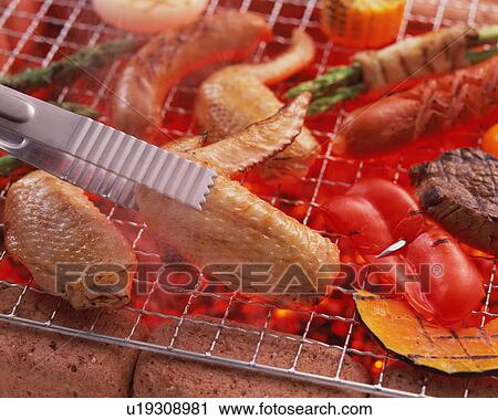 Stock Image - BBQ over charcoal. Fotosearch