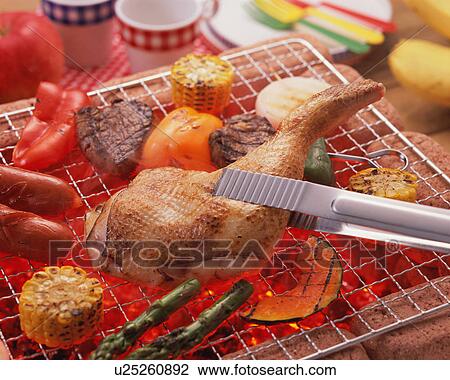Stock Image - BBQ over charcoal. Fotosearch