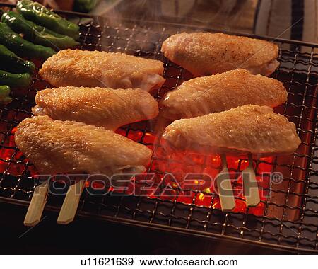 Grilled chicken wings over charcoal View Large Photo Image Stock Photo - Grilled chicken wings over charcoal. Fotosearch