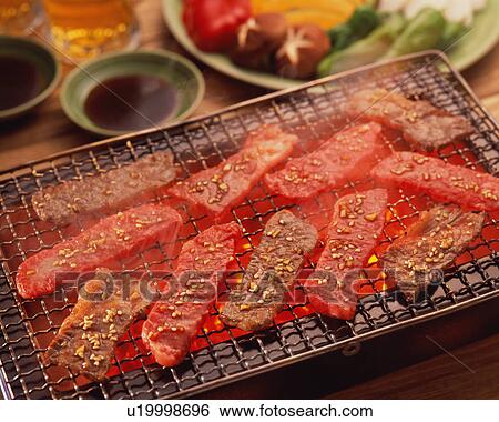 Slices of beef grilled over charcoal View Large Photo Image Stock Photograph - Slices of beef grilled over charcoal. Fotosearch