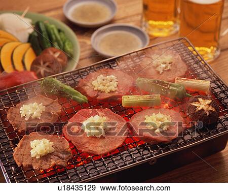 Slices of ox tongue grilled over charcoal View Large Photo Image Stock Photo - Slices of ox tongue grilled over charcoal. Fotosearch
