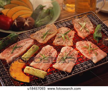 Slices of pork grilled over charcoal View Large Photo Image Stock Image - Slices of pork grilled over charcoal. Fotosearch