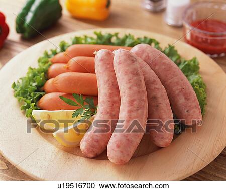 Stock Image - Uncooked sausages. Fotosearch