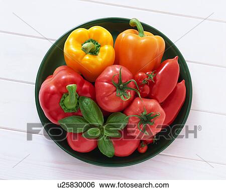 Stock Photograph - Tomato and paprika in a bowl. Fotosearch