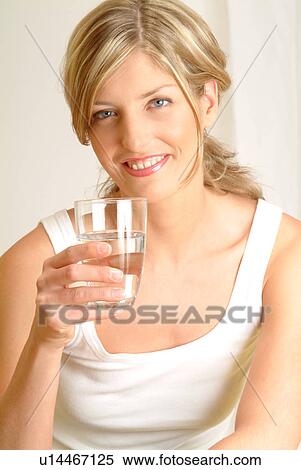 Stock Photography - Portrait of Woman drinking mineral water. Fotosearch