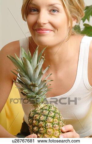 Woman with pineapple View Large Photo Image Stock Image - Woman with pineapple. Fotosearch