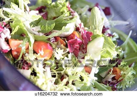 Stock Image - Fresh mixed salad, close up. Fotosearch