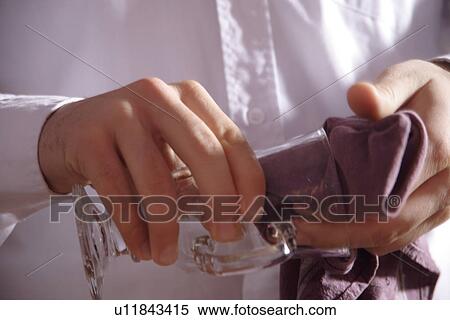 Male hands drying glass, close up View Large Photo Image Stock Photography - Male hands drying glass, close up. Fotosearch