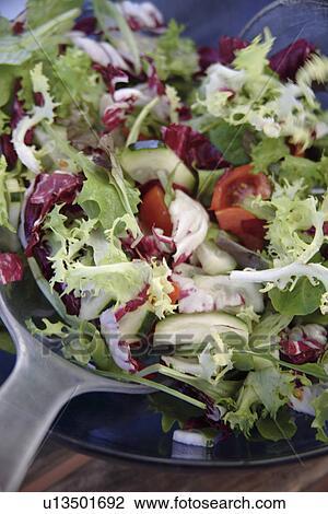 Preparing fresh salad: mixing everything in the salad bowl View Large Photo Image Stock Image - Preparing fresh salad: mixing everything in the salad bowl. Fotosearch