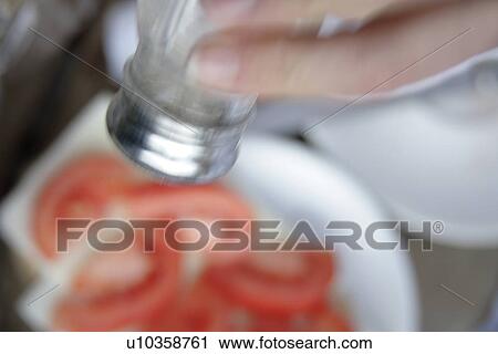Salting tomatoes, blurry, close up View Large Photo Image Stock Image - Salting tomatoes, blurry, close up. Fotosearch